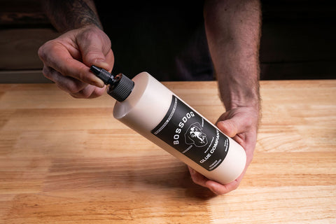 Nick Starrett holding bottle of BOSSDOG wood glue